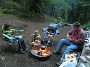 Eating muffins made inside orange peels in the coals of our fire at our first campsite.